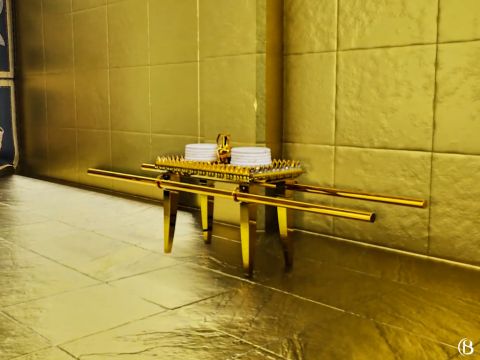 The table of showbread was placed on the north side of the first apartment of the sanctuary. The table was two cubits long, a cubit and a half in width, and a cubit and a half in height. It was overlaid with pure gold and ornamented with a crown of gold around the top. <br/>On the Sabbath day the Levites made twelve loaves, or cakes, of unleavened bread. These cakes were placed hot on the table each Sabbath day, arranged in two rows, or piles, six in a row, with pure frankincense on each row. <br/>During the entire week the bread lay on the table. By some translators it is called ‘the bread of the presence.’ At the end of the week it was removed and eaten by the priests. – Slide 7