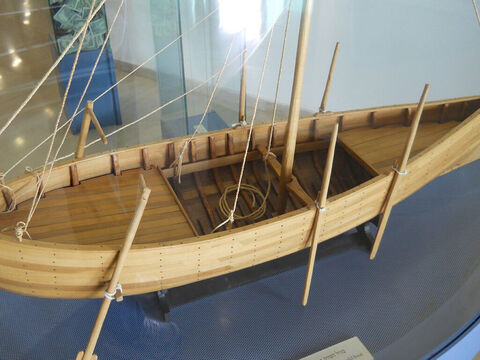 The boat could have been sailed or rowed. It would have used a single square sail affixed amidships. Based on the vessel's size, it probably would have had a basic crew of five to four rowers and a helmsman. The boat would have been steered by means of two steering oars. – Slide 13