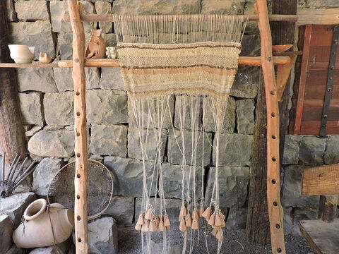 Lengths of yarn were hung from a top frame to fall vertically to the ground. – Slide 12